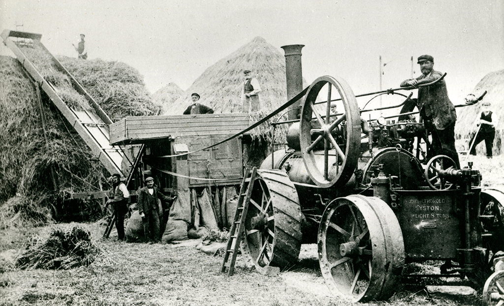 An unidentified Tuxford & Sons traction engine and period threshing scene.