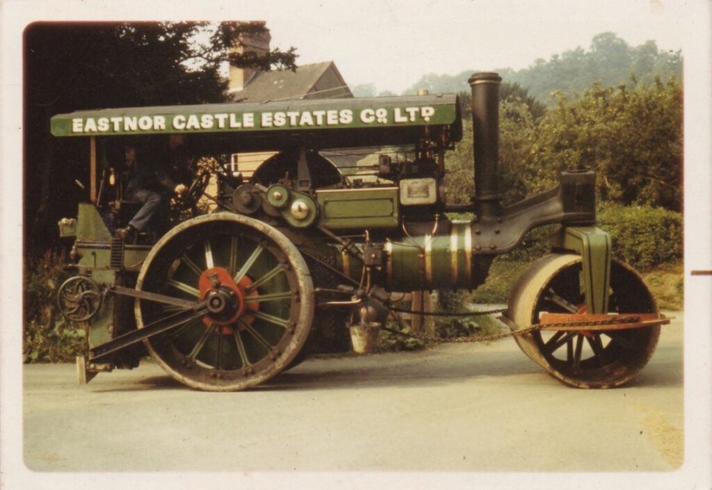 Aveling & Porter No. 14077 at Eastnor. Photo shows a Steam Roller from the offside, The roller has a scarifier and a full length canopy  on the Eastnor Castle estate.